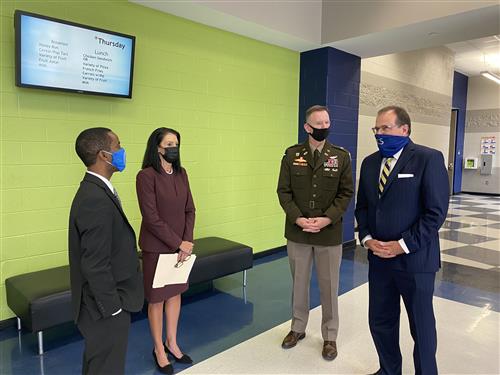 Superintendents circled up with Redstone Col. Glenn Mellor in James Clemens High School lobby